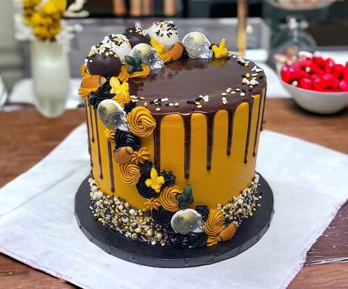 Who Dat Triple Layer Cake with Chocolate Pour and Cake Balls!